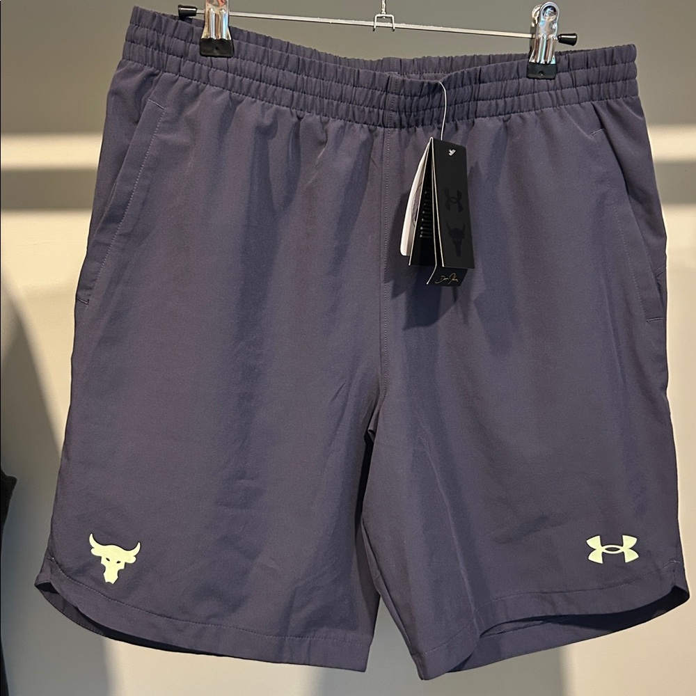 Under Armour boys shorts. Youth XL. Grayish/purple color. NWT.